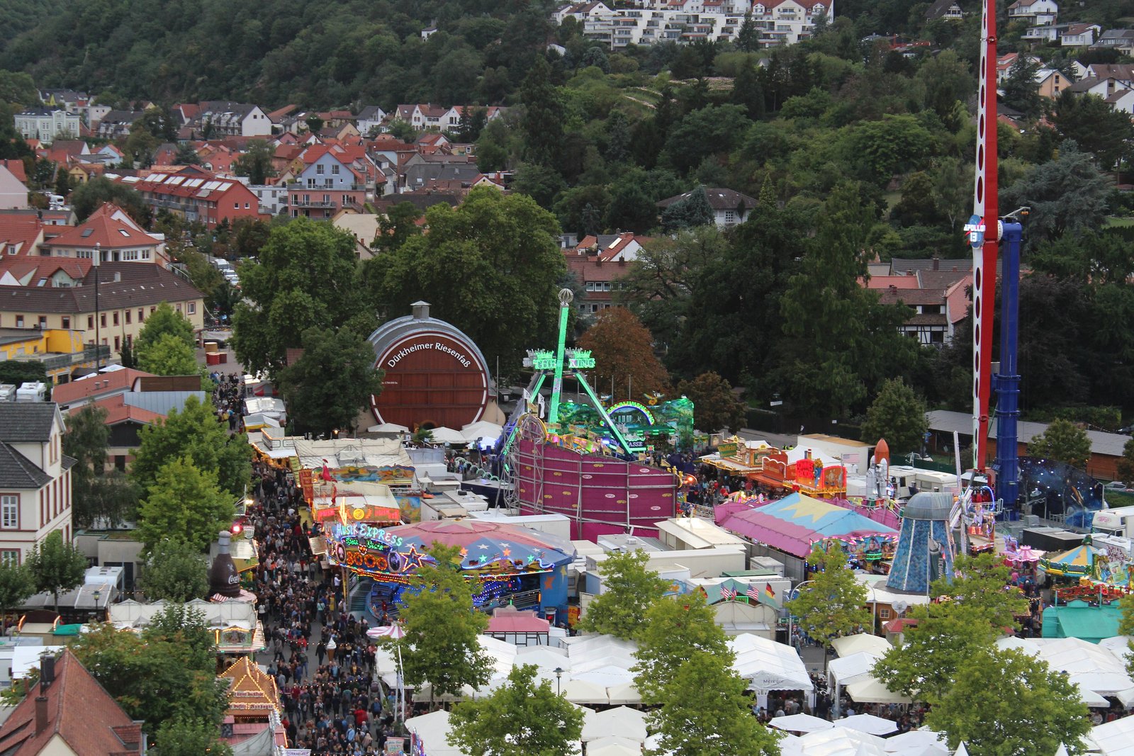 Aerial view of the Dürkheimer Wurstmarkt fairground with the giant wine barrel among stalls and rides