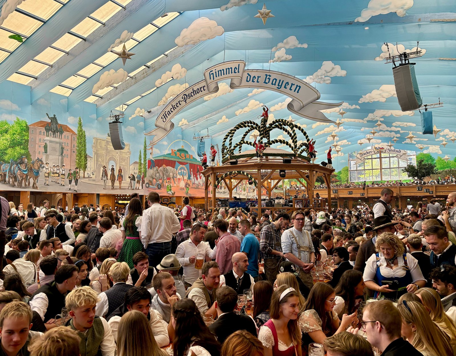 Inside the Hacker-Festzelt beer tent at the Oktoberfest, under its painted sky ceiling