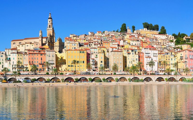 Colourful old town of Menton reflected in the sea on the Côte d'Azur