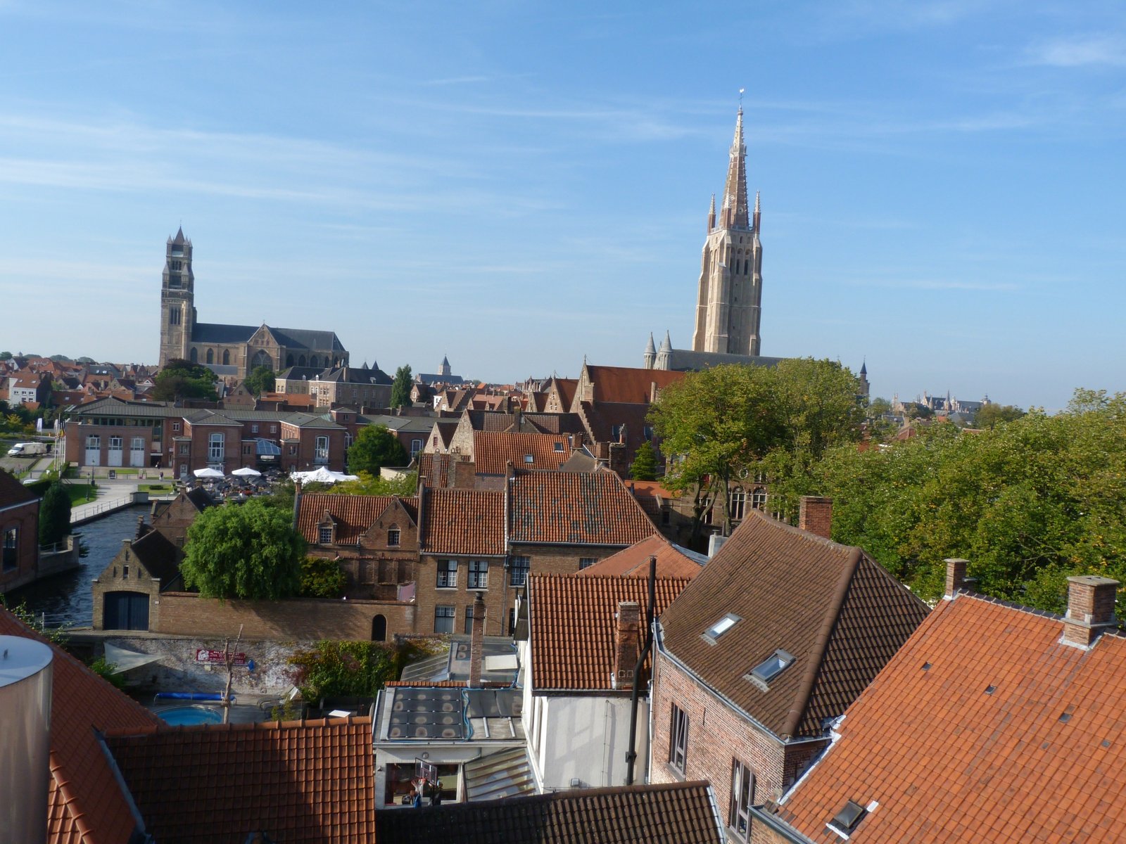 Bruges red roofs and church spires seen from the De Halve Maan brewery