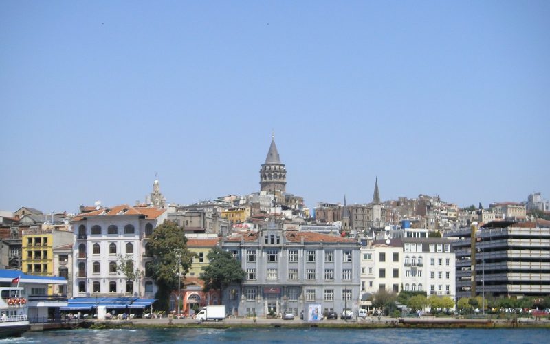 Galata Tower rising above the waterfront houses of Istanbul on the Golden Horn