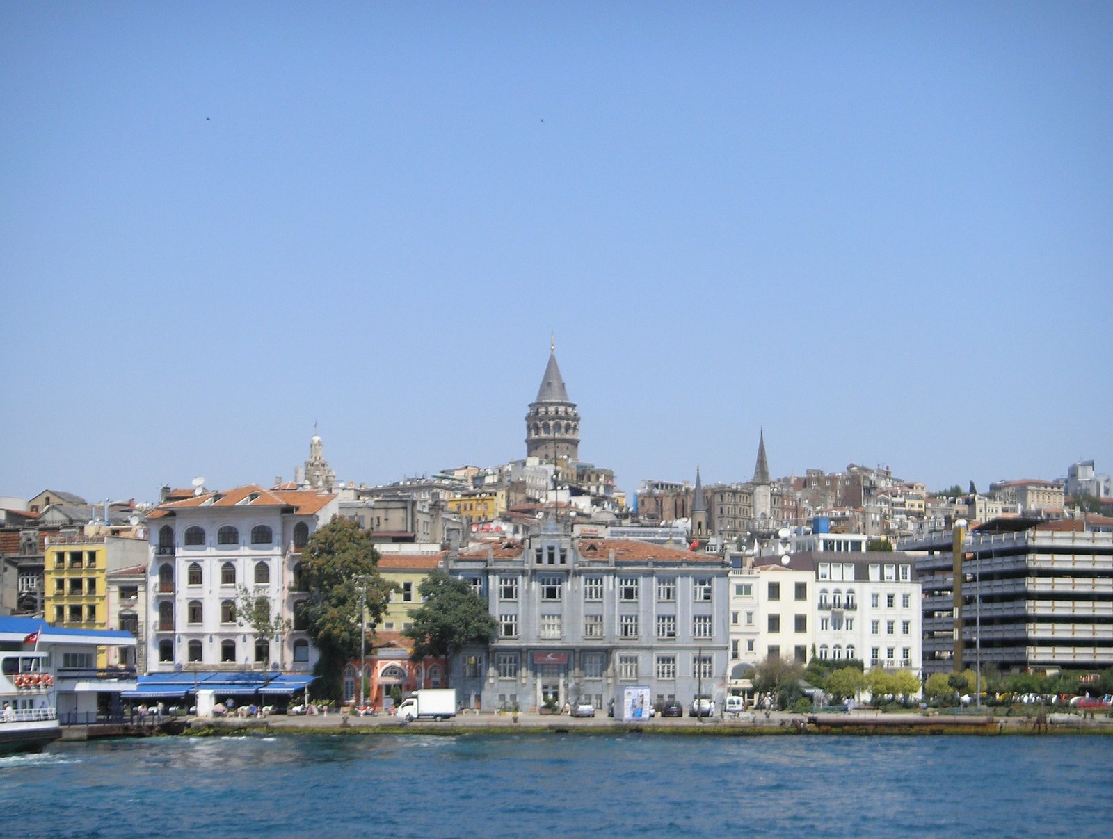 Galata Tower rising above the waterfront houses of Istanbul on the Golden Horn