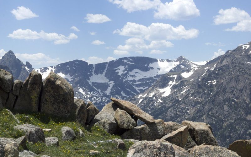 Snow-capped peaks and boulders in the Colorado Rockies