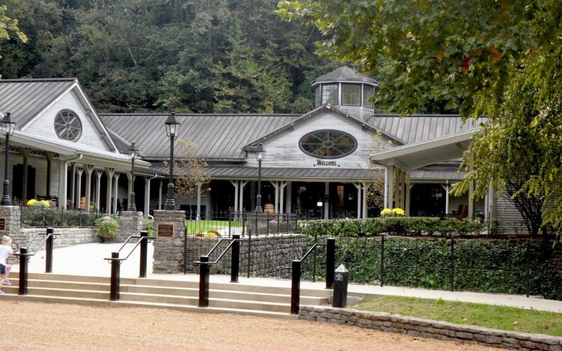 Visitor center building of the Jack Daniel Distillery among trees in Lynchburg, Tennessee