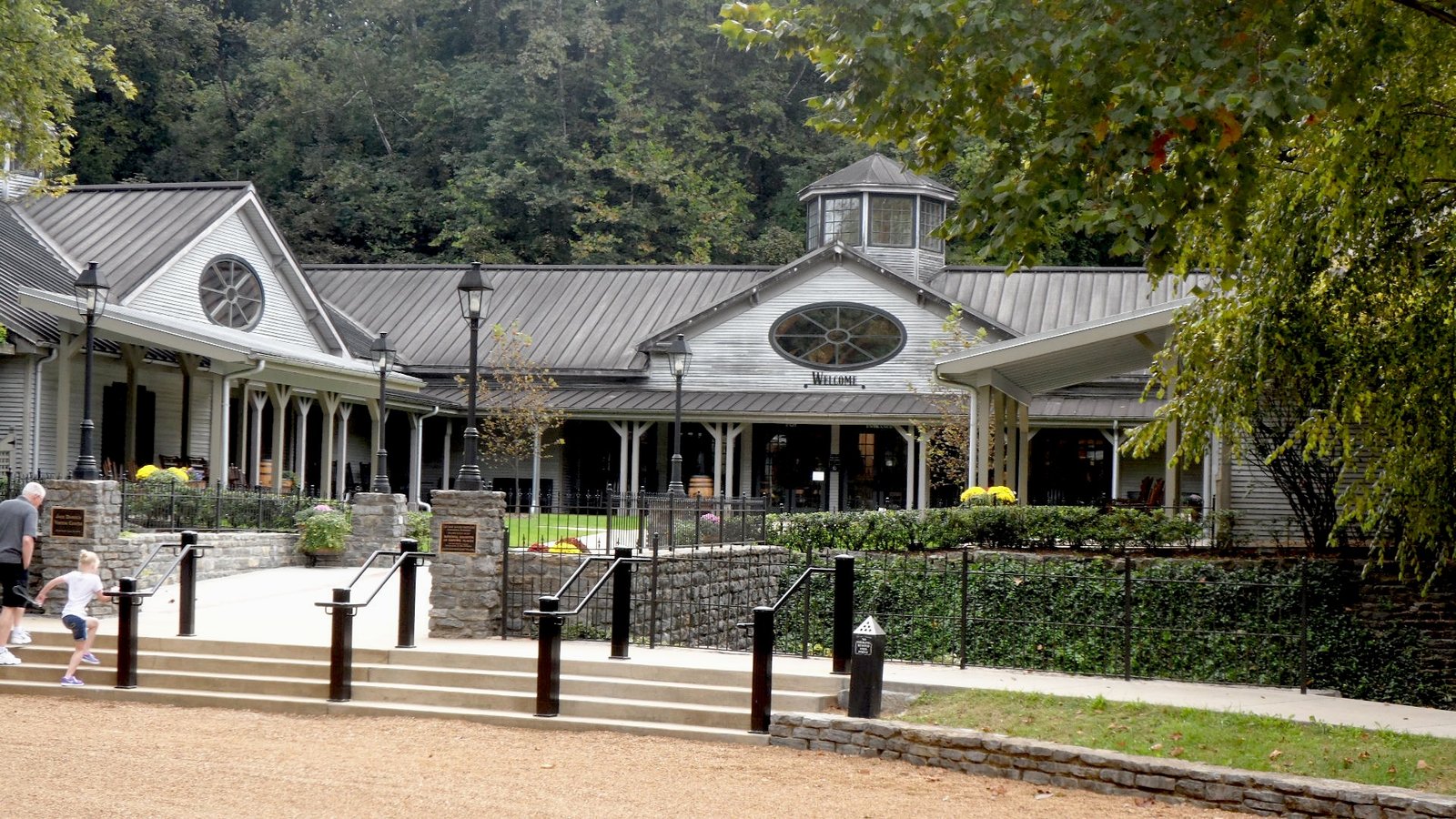 Visitor center building of the Jack Daniel Distillery among trees in Lynchburg, Tennessee