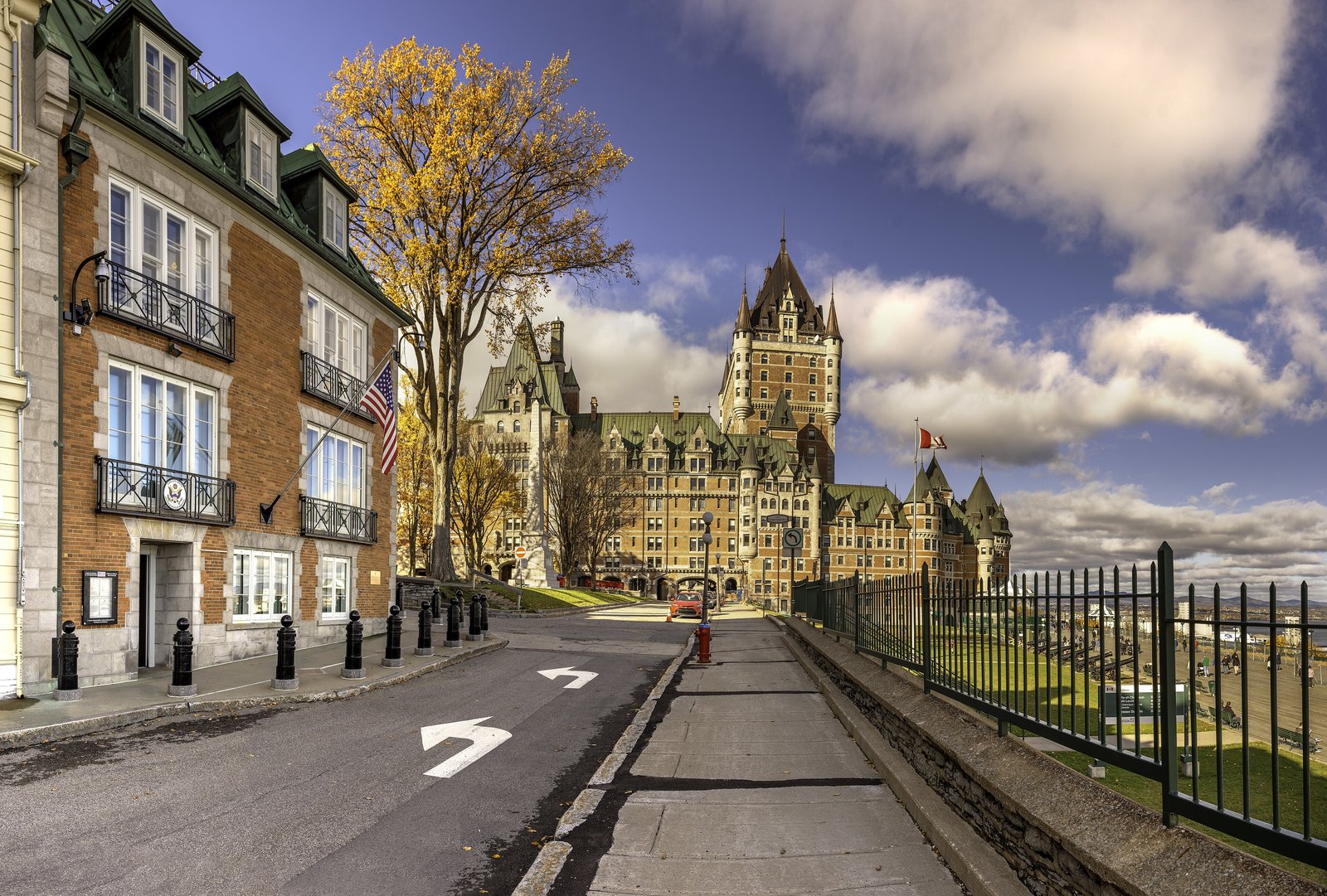 Château Frontenac seen from a street in Old Quebec under a dramatic sky