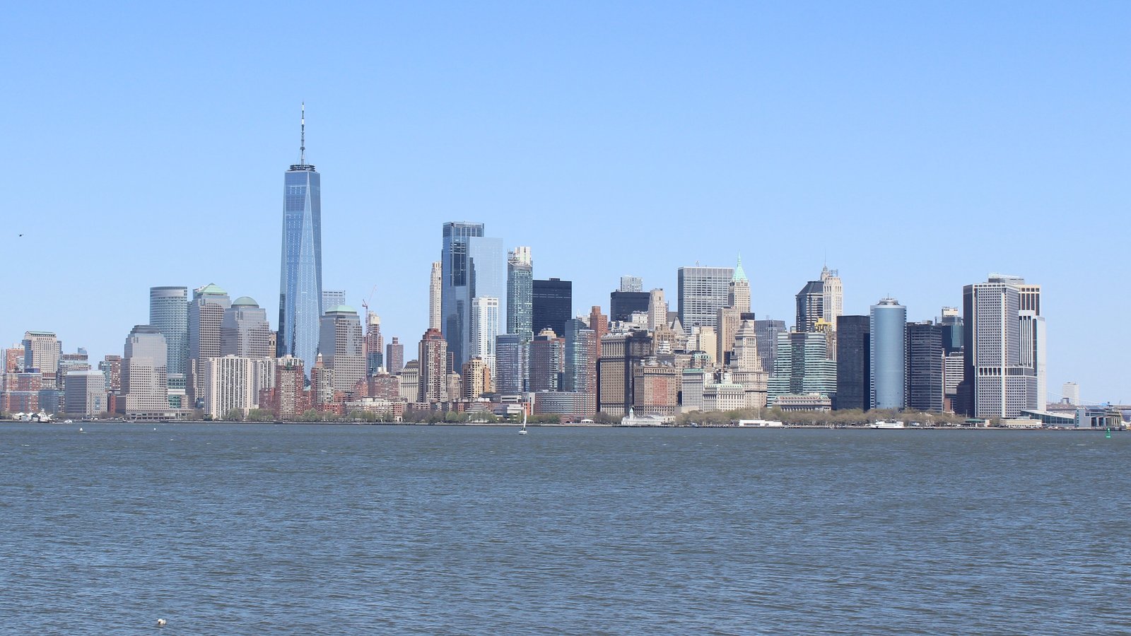 Lower Manhattan skyline across the harbour on a clear day