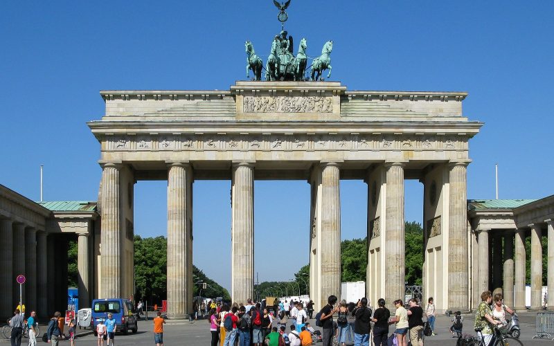 The Brandenburg Gate in Berlin against a deep blue sky