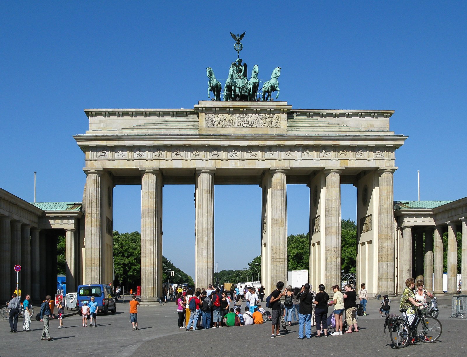 The Brandenburg Gate in Berlin against a deep blue sky