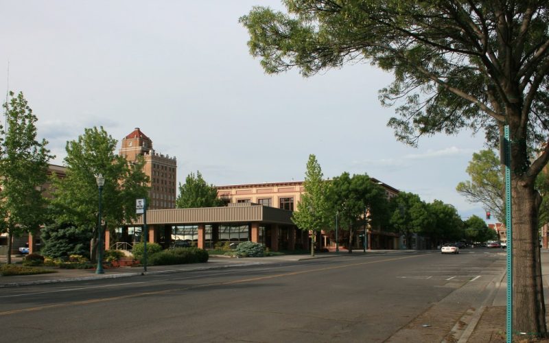 Tree-lined downtown street in Walla Walla, Washington, at dusk