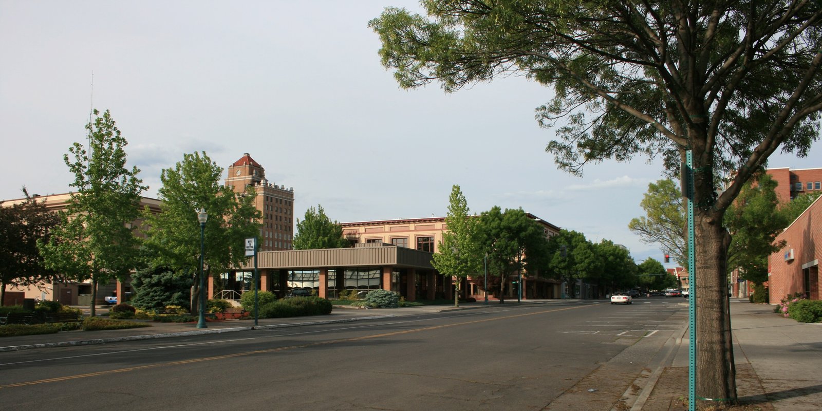 Tree-lined downtown street in Walla Walla, Washington, at dusk
