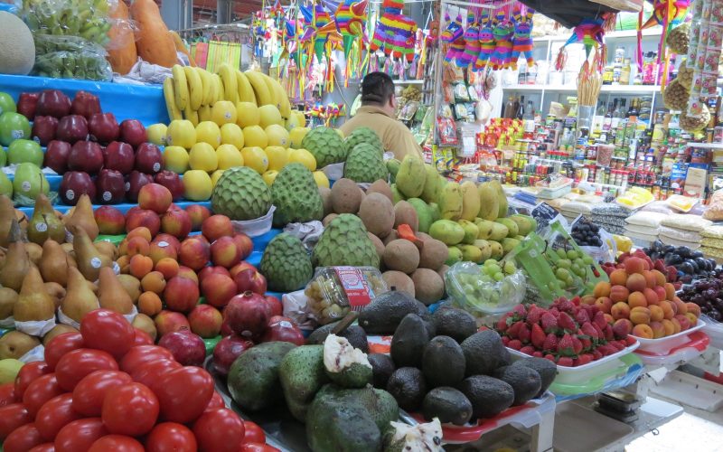 Colourful fruit stalls inside the Mercado de San Juan in Mexico City