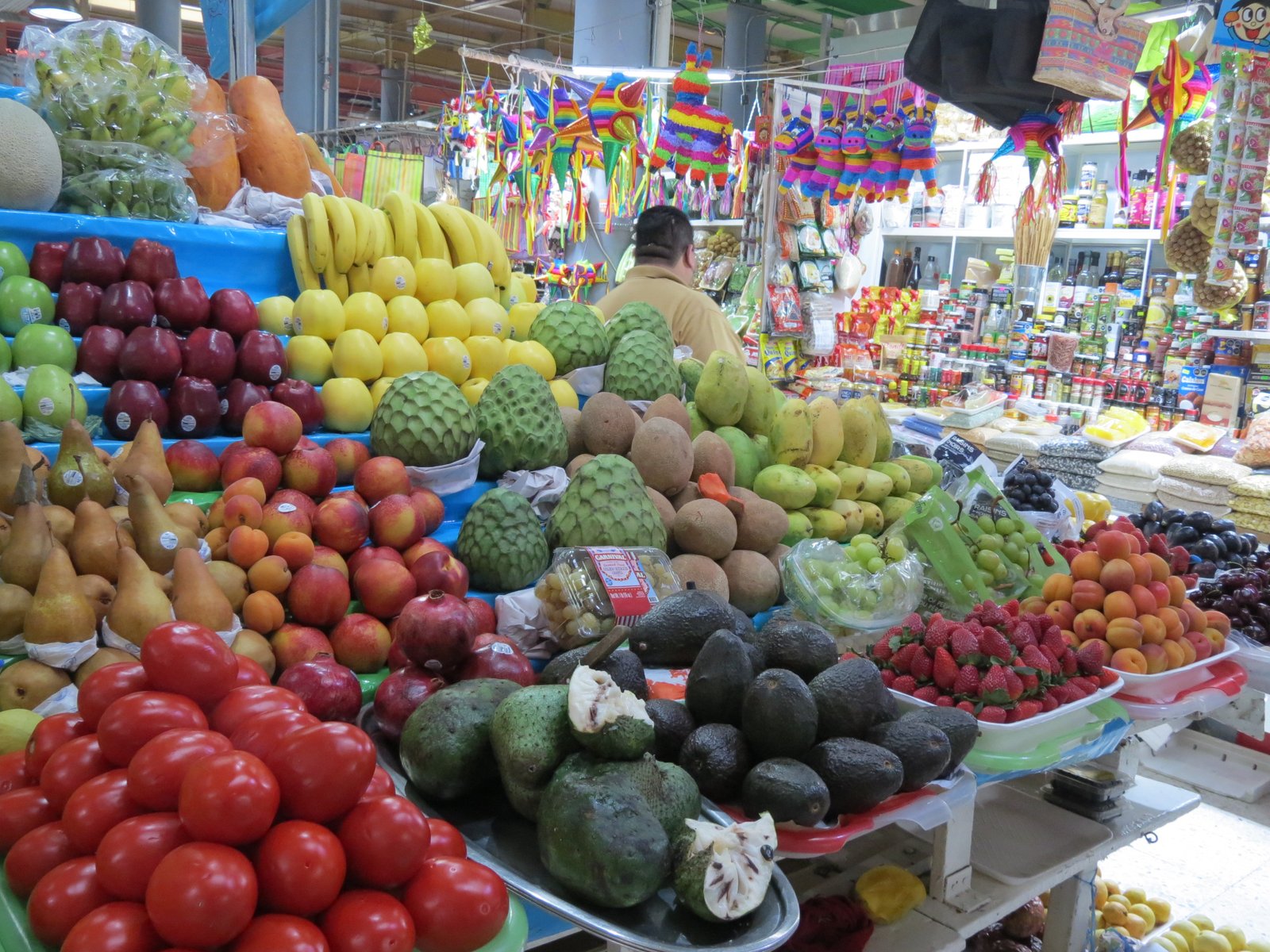 Colourful fruit stalls inside the Mercado de San Juan in Mexico City