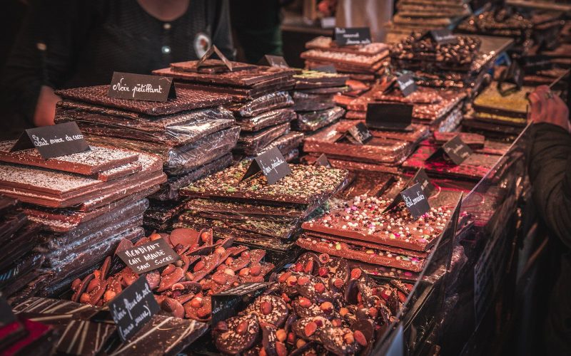 Stall piled with chocolate bars and slabs at the Salon du Chocolat in Paris