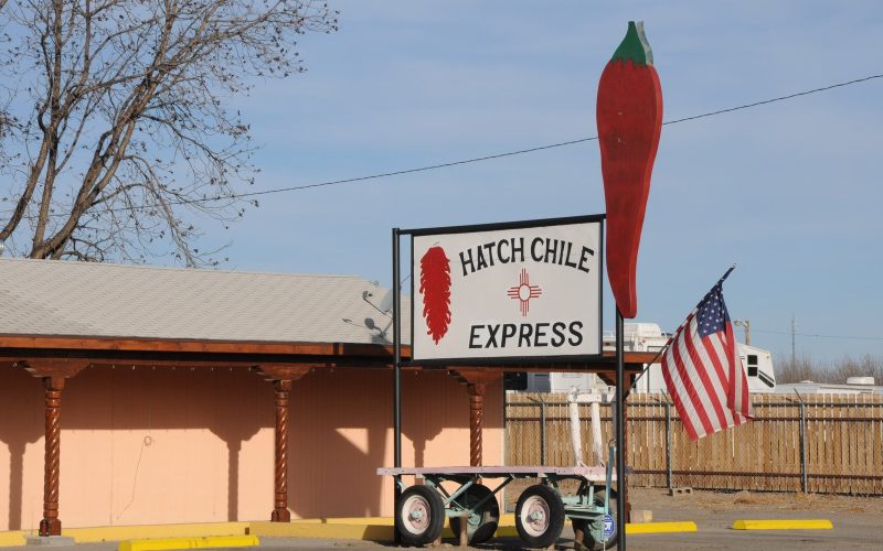Hatch Chile Express roadside stand with giant red chile sign