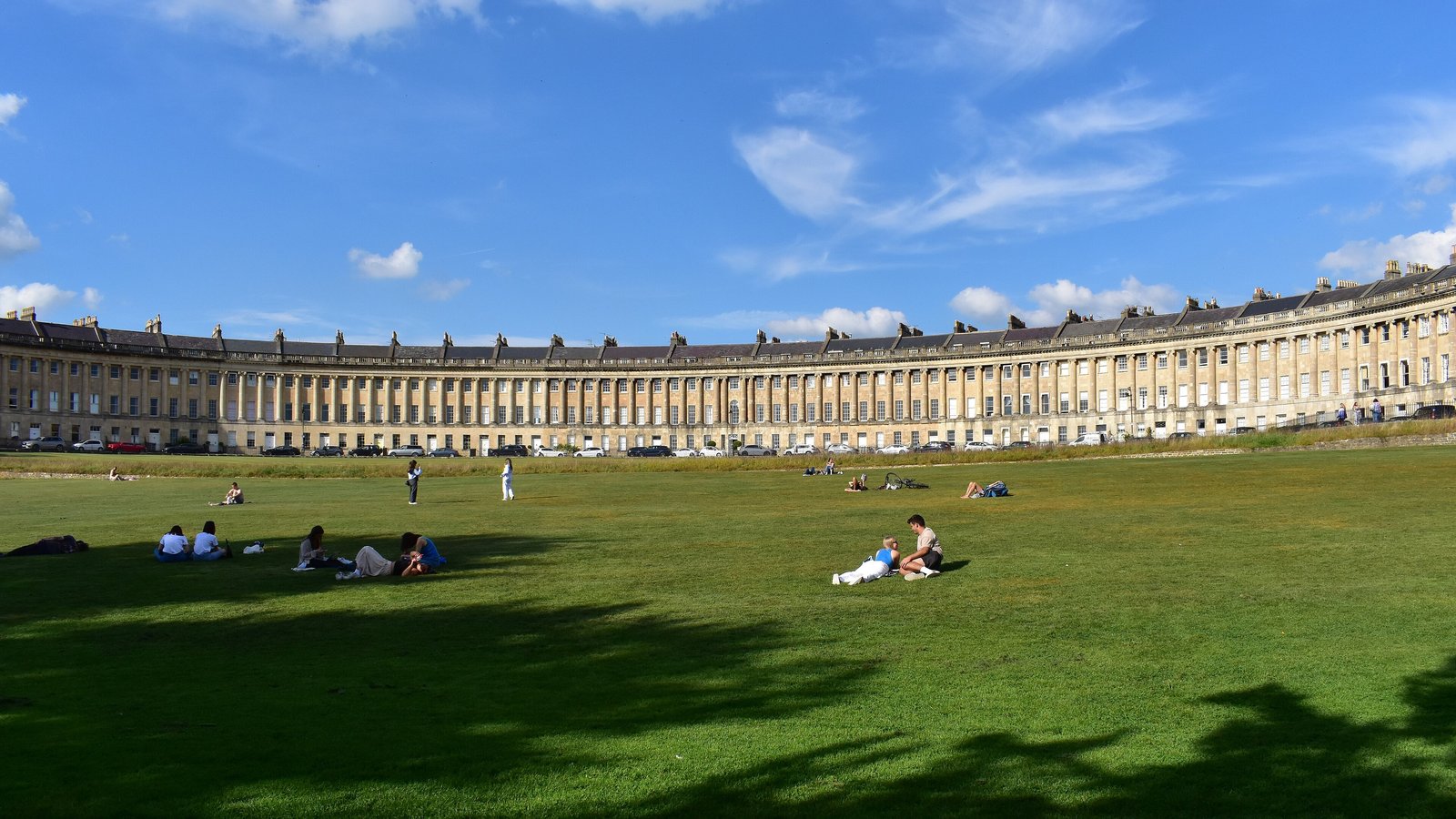 Royal Crescent lawn in Bath under a blue sky