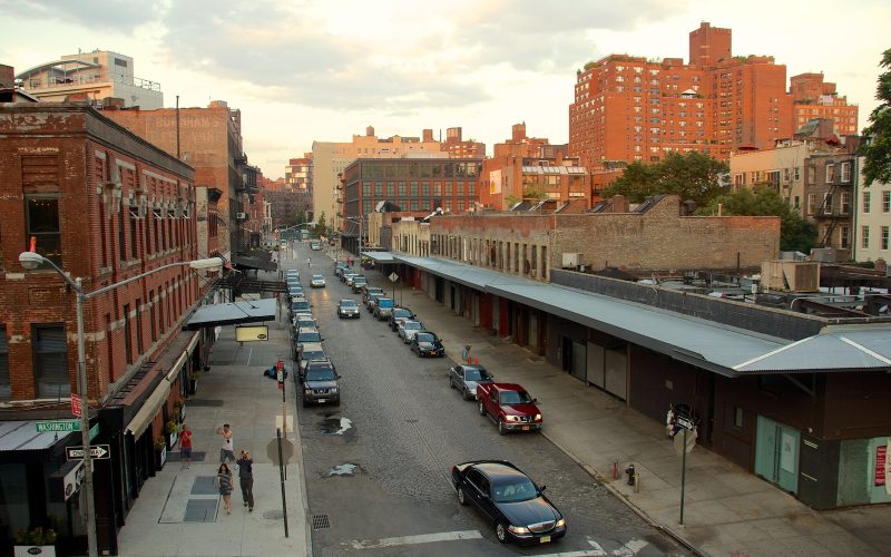 Brick warehouses and a street in Manhattan's Meatpacking District seen from the High Line at sunset