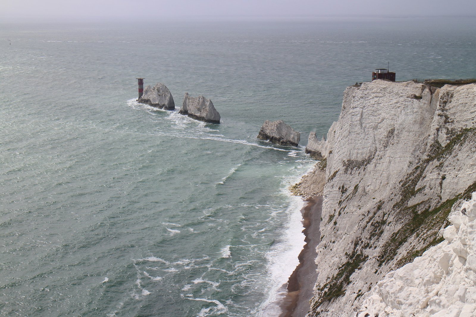 The Needles chalk stacks and lighthouse seen from the Isle of Wight cliffs