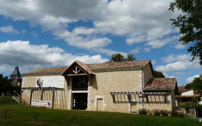 Truffle ecomuseum, a stone building under a blue sky in Sorges, Périgord