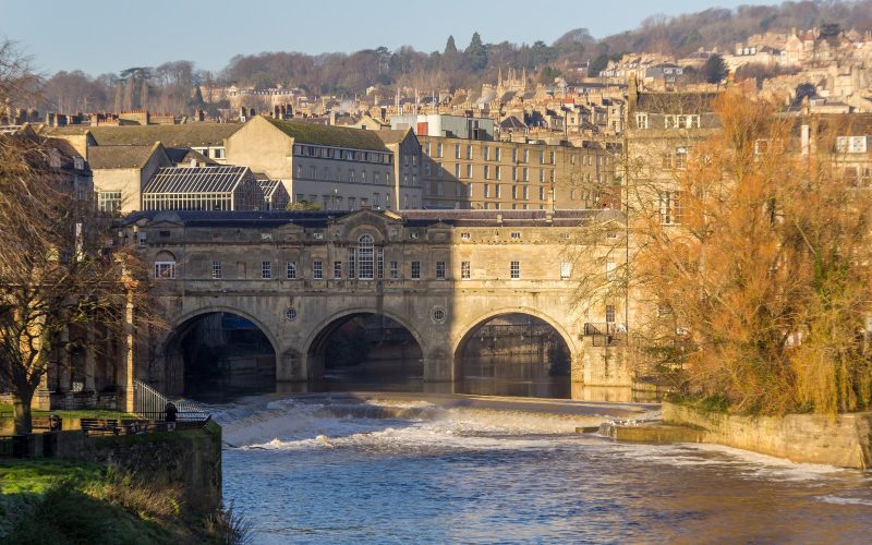 Pulteney Bridge and the weir on the River Avon in Bath in golden light