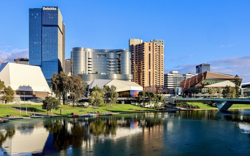 Adelaide city skyline reflected in the River Torrens on a sunny day