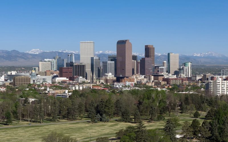 Downtown Denver skyline with the Rocky Mountains behind