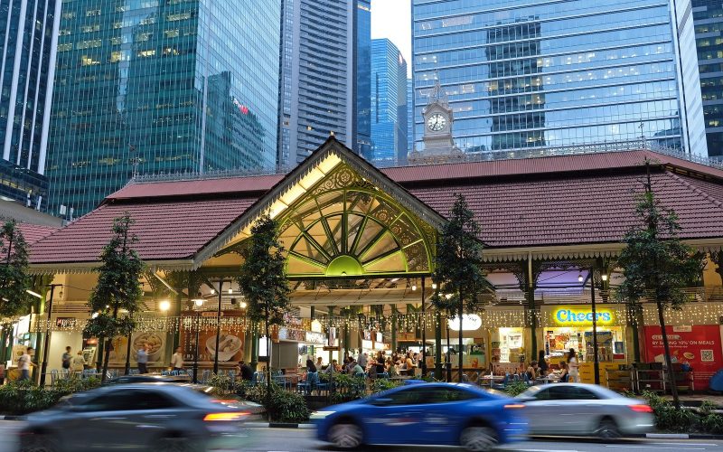 Lau Pa Sat hawker centre pavilion framed by skyscrapers in Singapore
