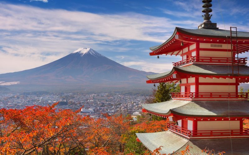 Chureito Pagoda and snow-capped Mount Fuji above autumn foliage