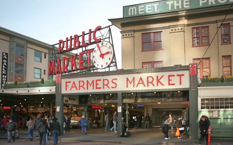 Pike Place Public Market entrance with its clock and sign in Seattle