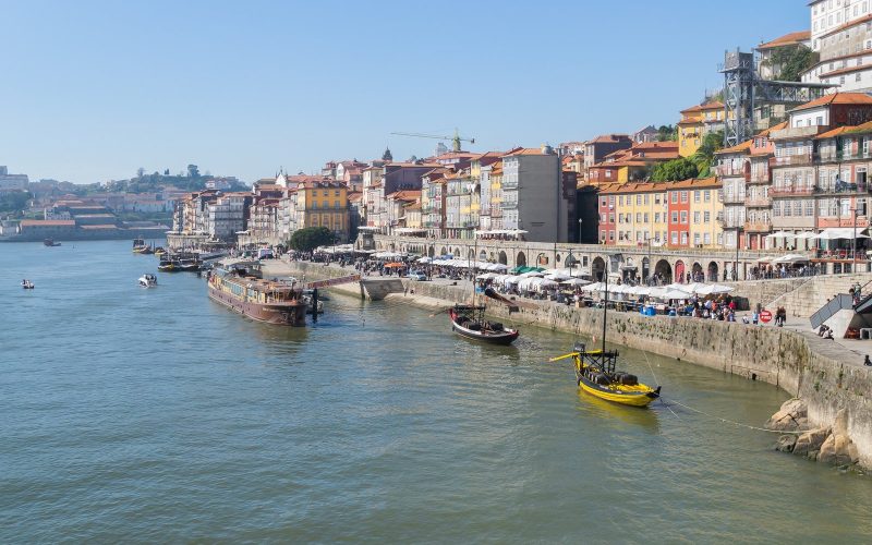 Porto's Ribeira waterfront with colourful houses and traditional boats on the Douro