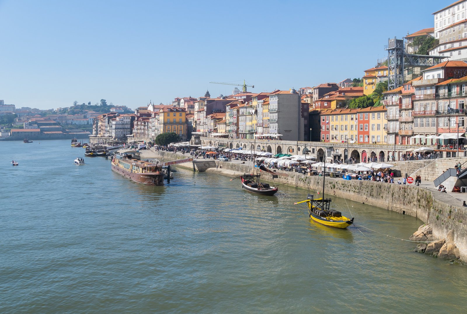 Porto's Ribeira waterfront with colourful houses and traditional boats on the Douro