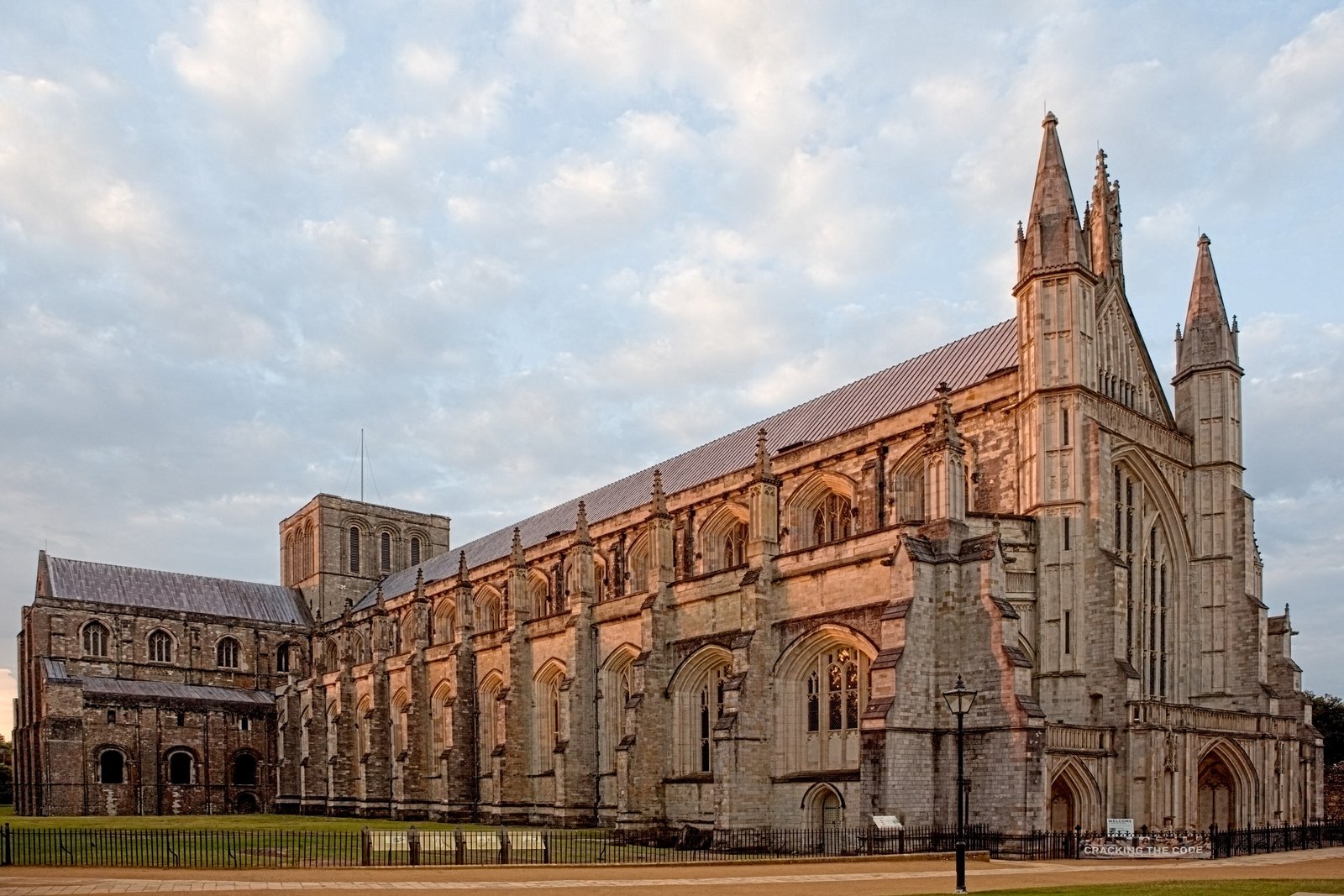 Winchester Cathedral nave seen from the side in warm evening light