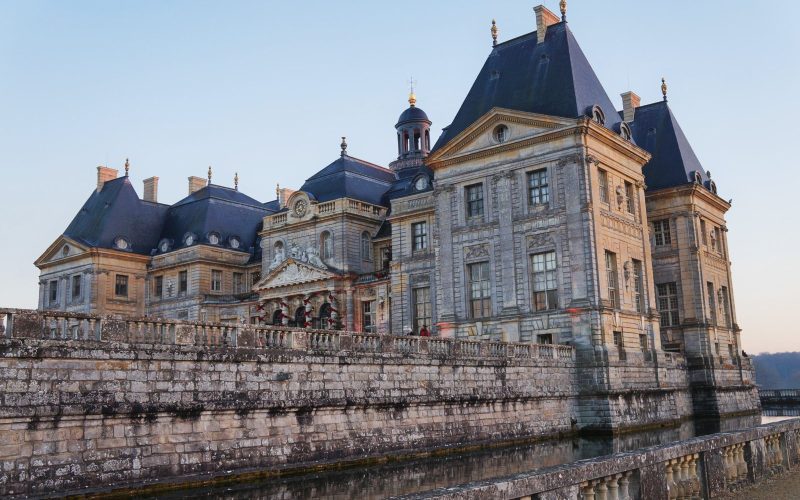 Château de Vaux-le-Vicomte and its moat at dusk in Île-de-France