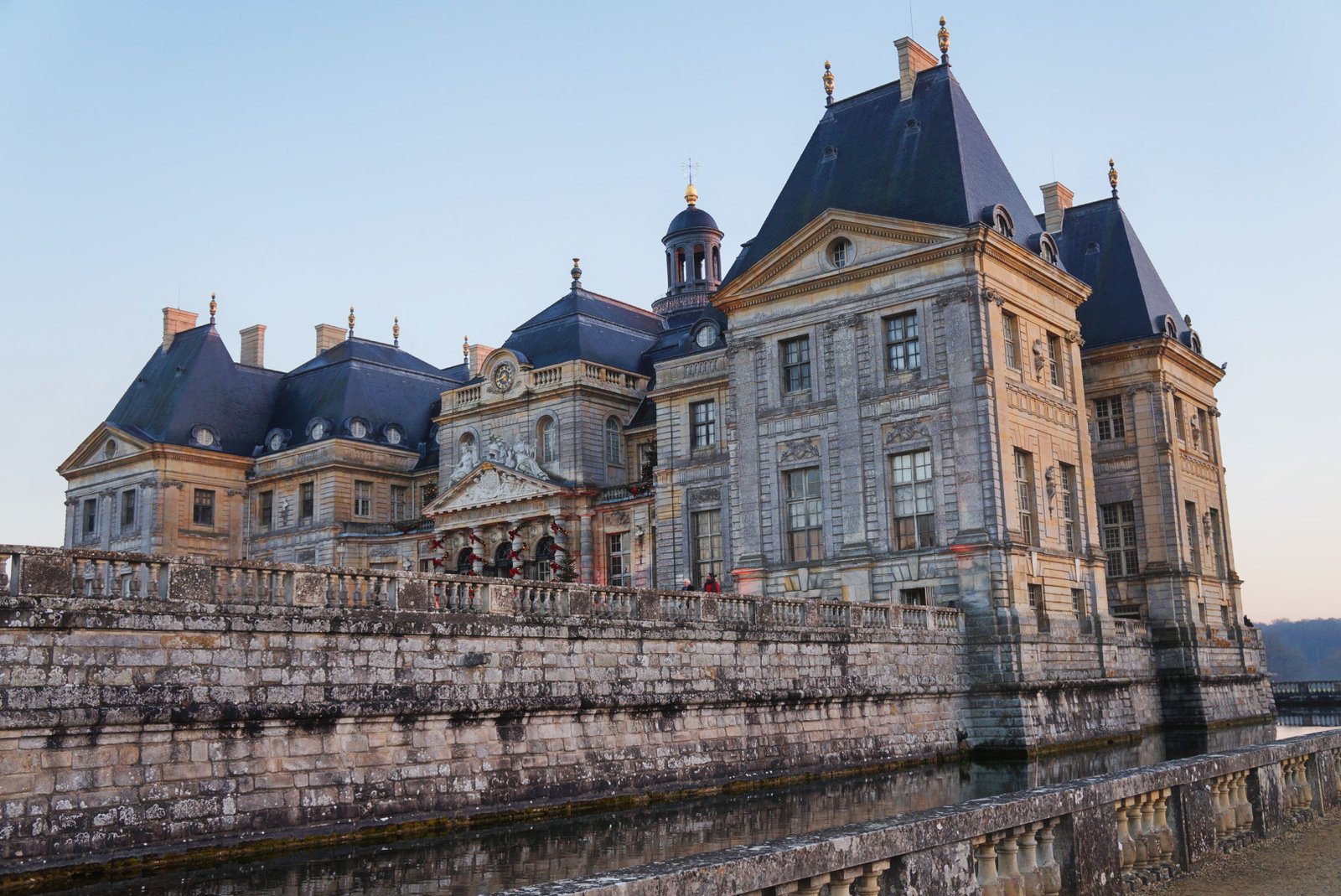 Château de Vaux-le-Vicomte and its moat at dusk in Île-de-France