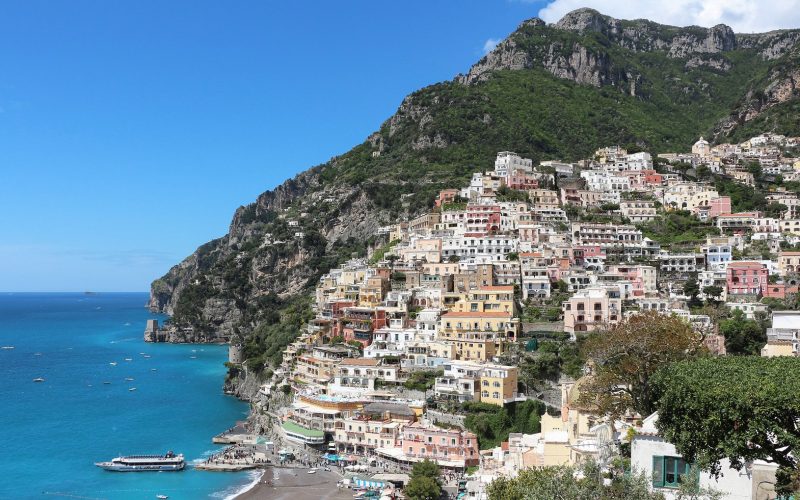 Pastel houses climbing the cliffs above the turquoise sea at Positano on the Amalfi Coast
