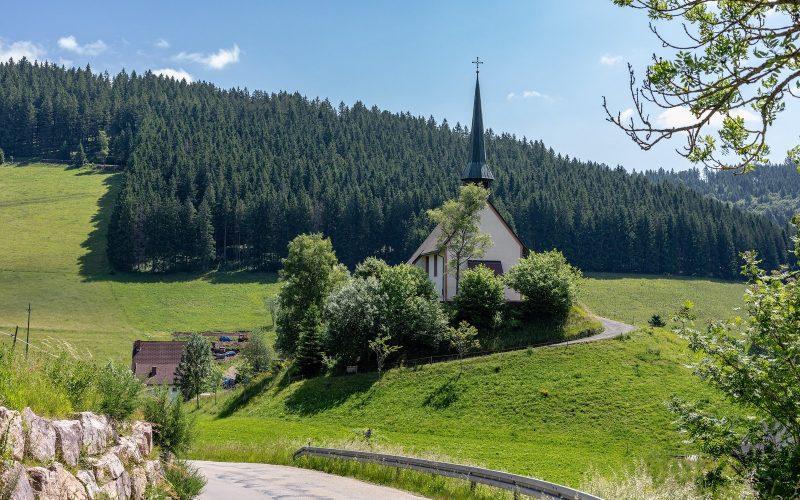 Small chapel among green meadows and fir forest in the Black Forest near Furtwangen