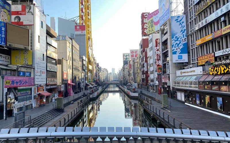 Dotonbori canal lined with signs and shops in Osaka