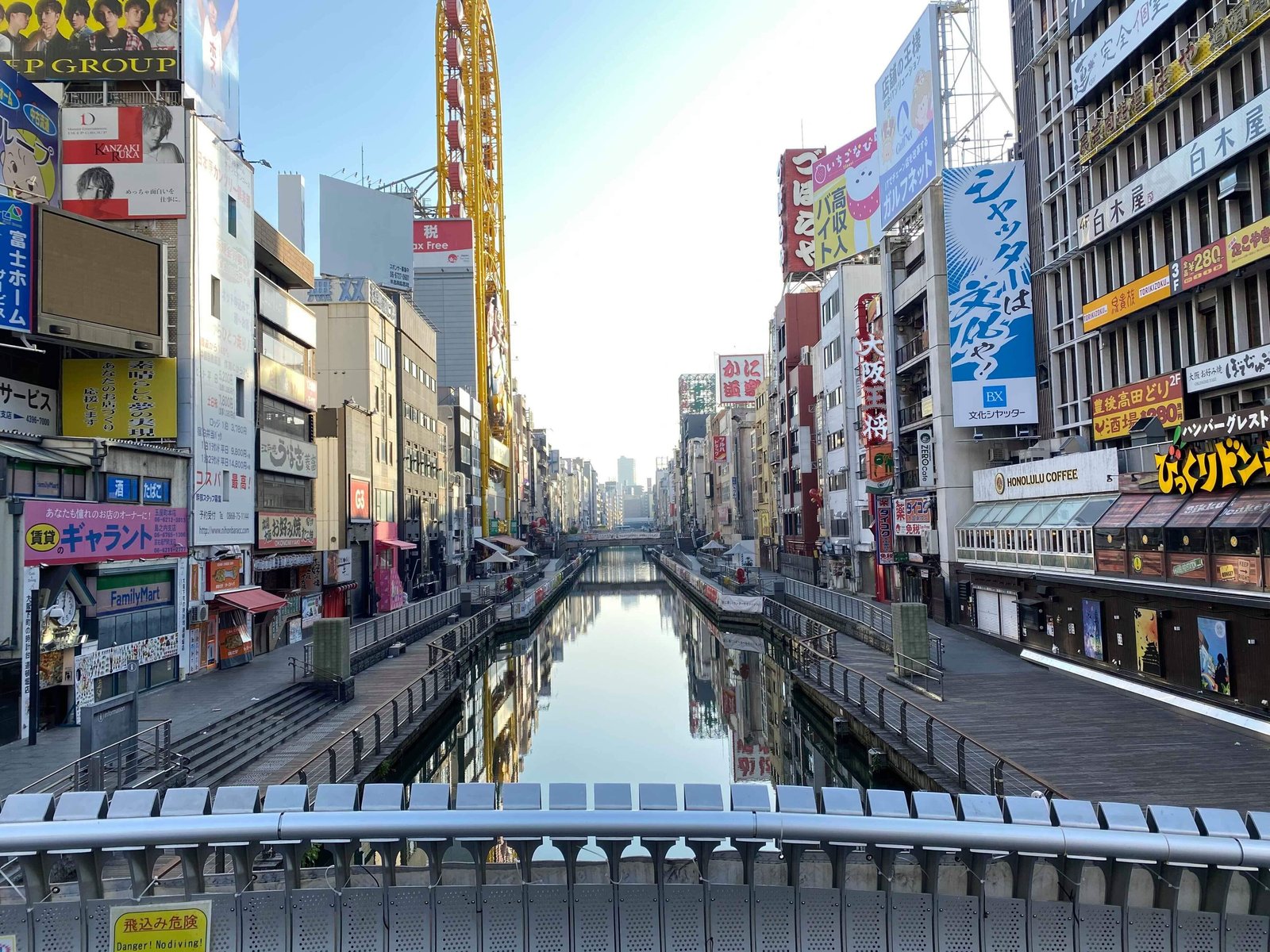 Dotonbori canal lined with signs and shops in Osaka