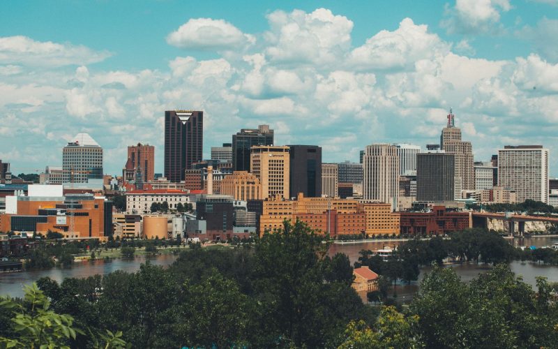 Saint Paul skyline above the Mississippi under summer clouds