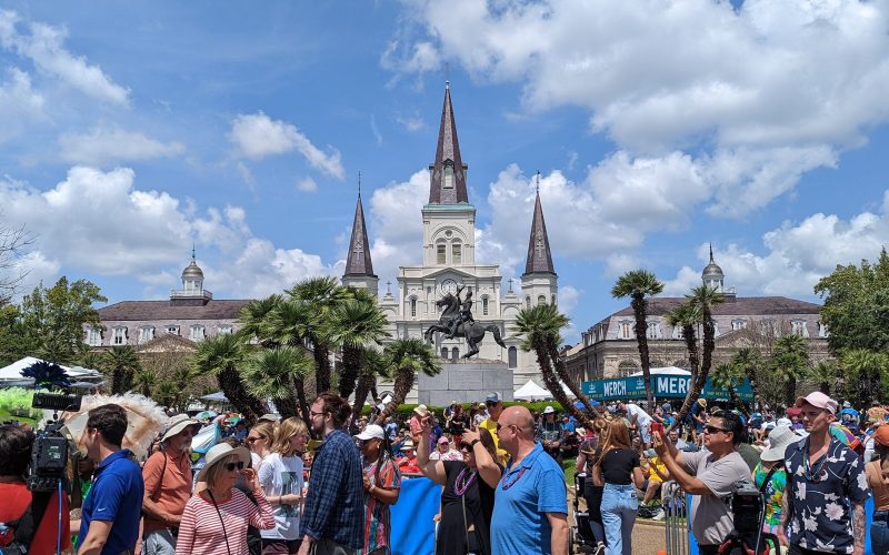 Festival crowd in Jackson Square with St. Louis Cathedral behind, New Orleans