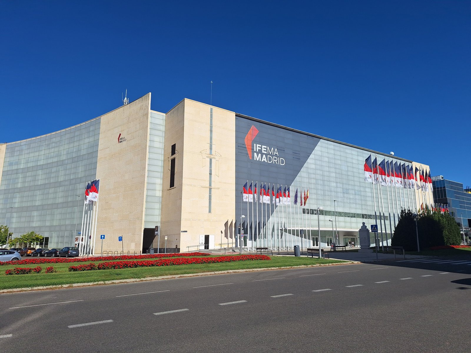 IFEMA Madrid exhibition centre facade under a clear blue sky